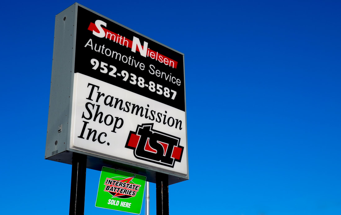 The sign on Blake Road in Hopkins says Smith Nielsen Automotive and Transmission Shop.