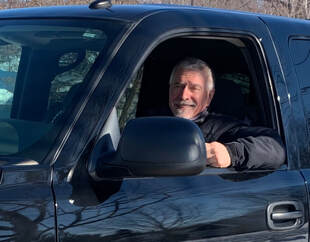 Satisfied customer, Tony from Elk River, sits in his truck.